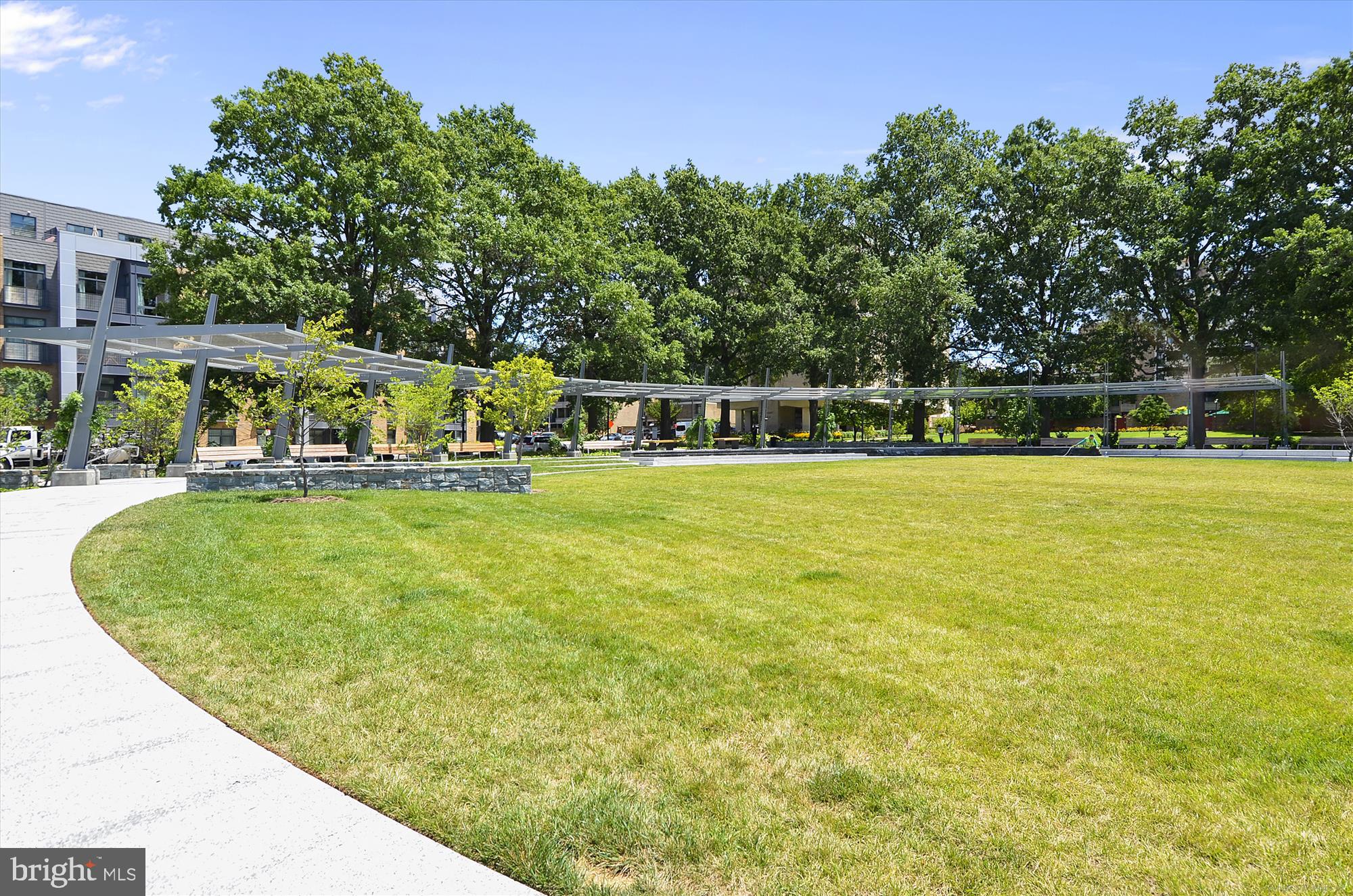 1311 Delaware Avenue Southwest, Unit S331 Washington, DC 20024 - Photo 35 of 35 a view of a swimming pool with lawn chairs and plants