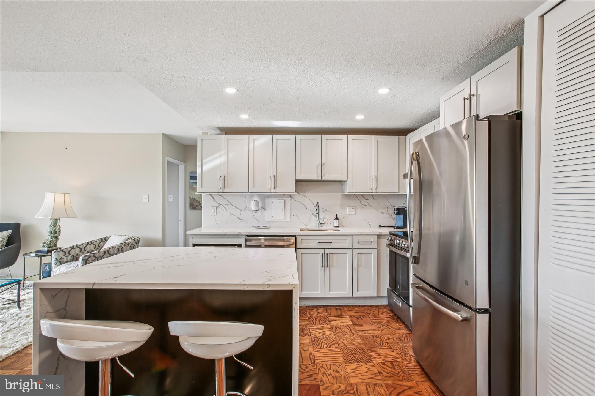 1311 Delaware Avenue Southwest, Unit S331 Washington, DC 20024 - Photo 4 of 35 a kitchen with stainless steel appliances granite countertop a refrigerator a sink and a stove