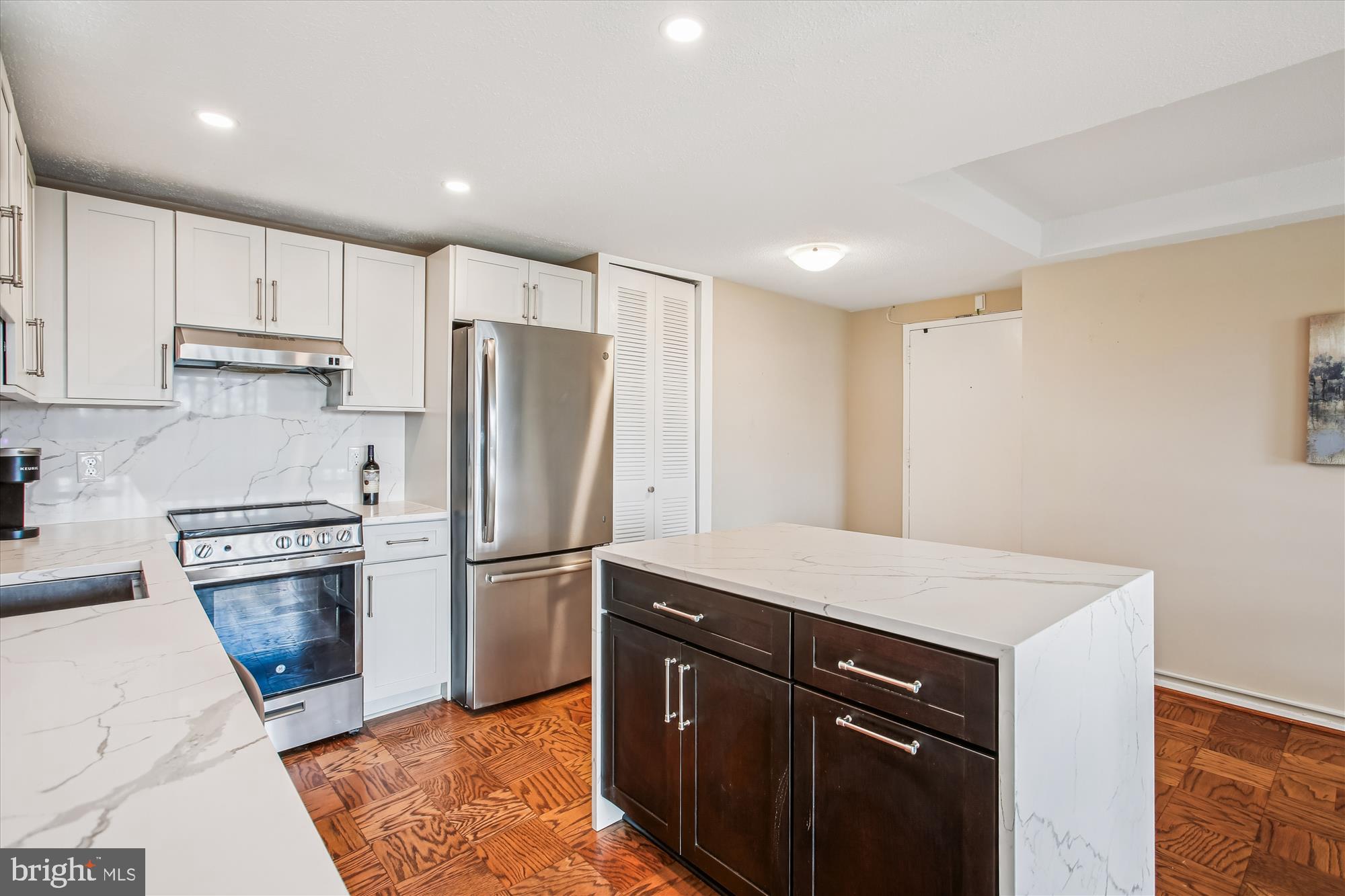 1311 Delaware Avenue Southwest, Unit S331 Washington, DC 20024 - Photo 5 of 35 a kitchen with a refrigerator sink and cabinets