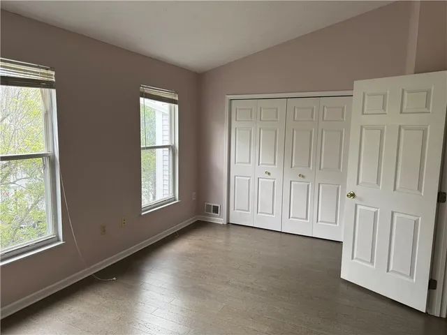 a view of an empty room and a window