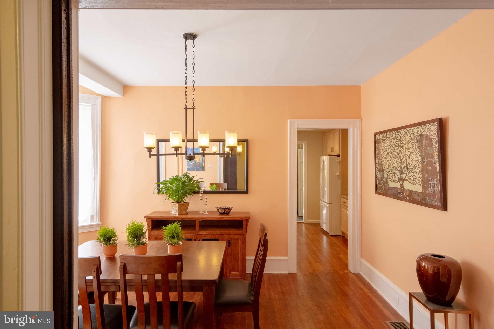2526 South Cleveland Street Philadelphia, PA 19145 - Photo 11 of 29 a view of a dining room with furniture window and wooden floor