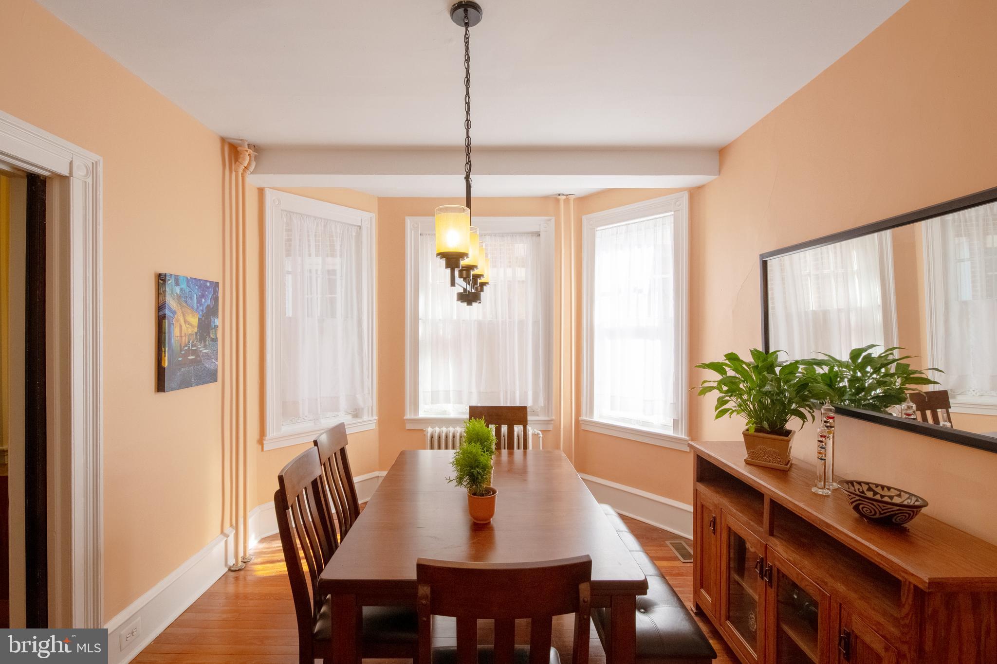 2526 South Cleveland Street Philadelphia, PA 19145 - Photo 12 of 29 a view of a dining room with furniture window and wooden floor