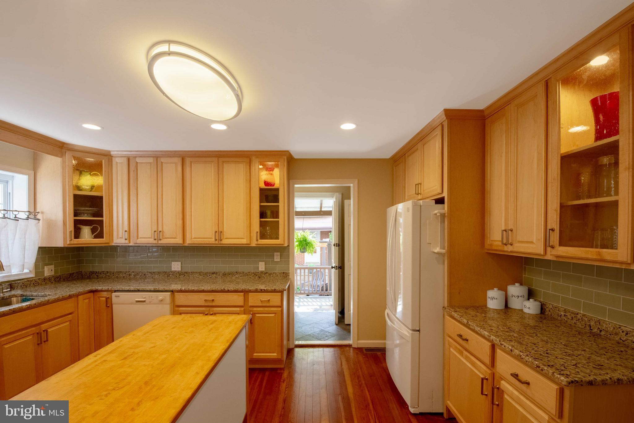 2526 South Cleveland Street Philadelphia, PA 19145 - Photo 14 of 29 a kitchen with stainless steel appliances granite countertop a refrigerator a stove and a sink with cabinets