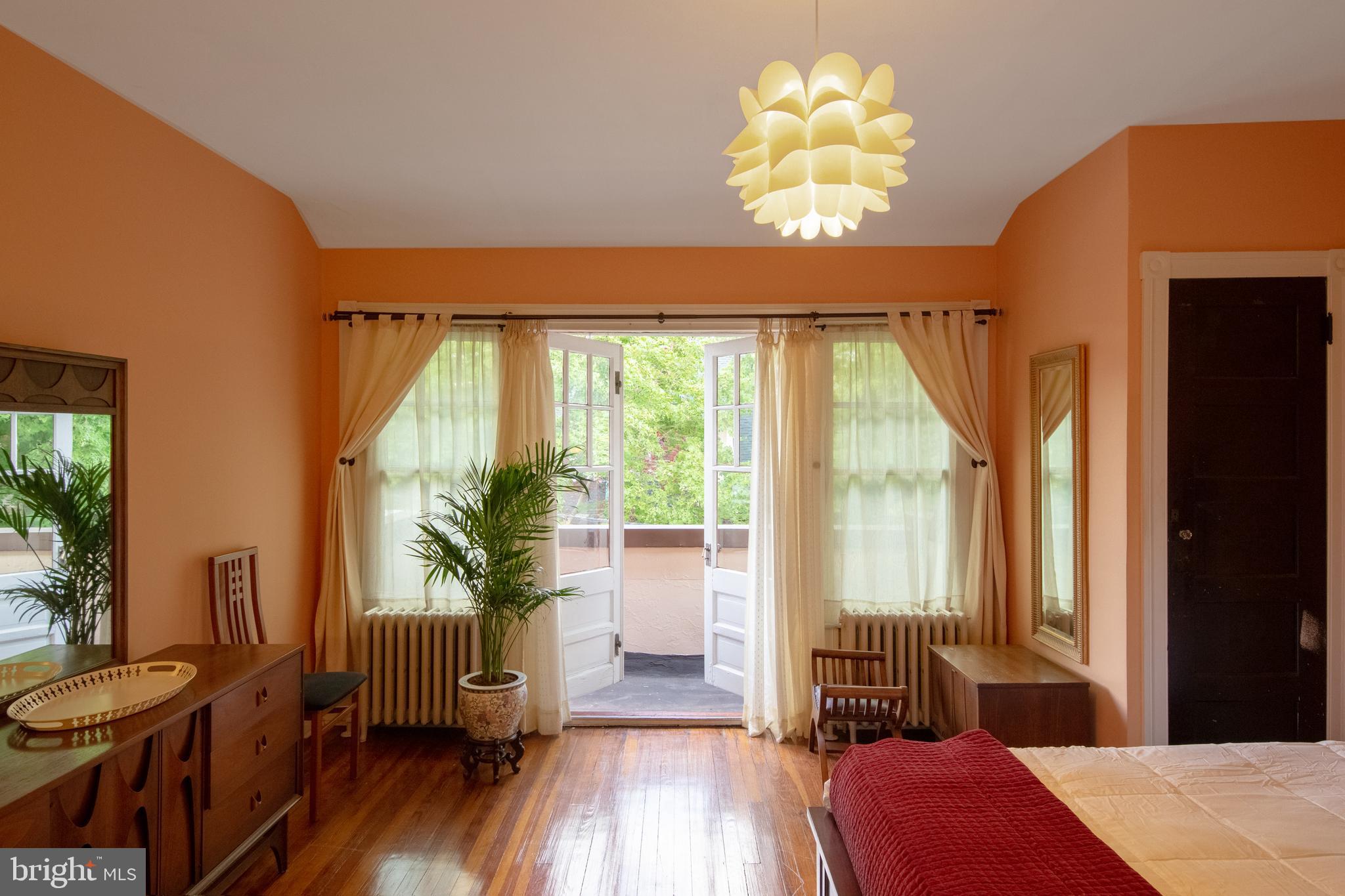 2526 South Cleveland Street Philadelphia, PA 19145 - Photo 21 of 29 a bedroom with a bed and a large window