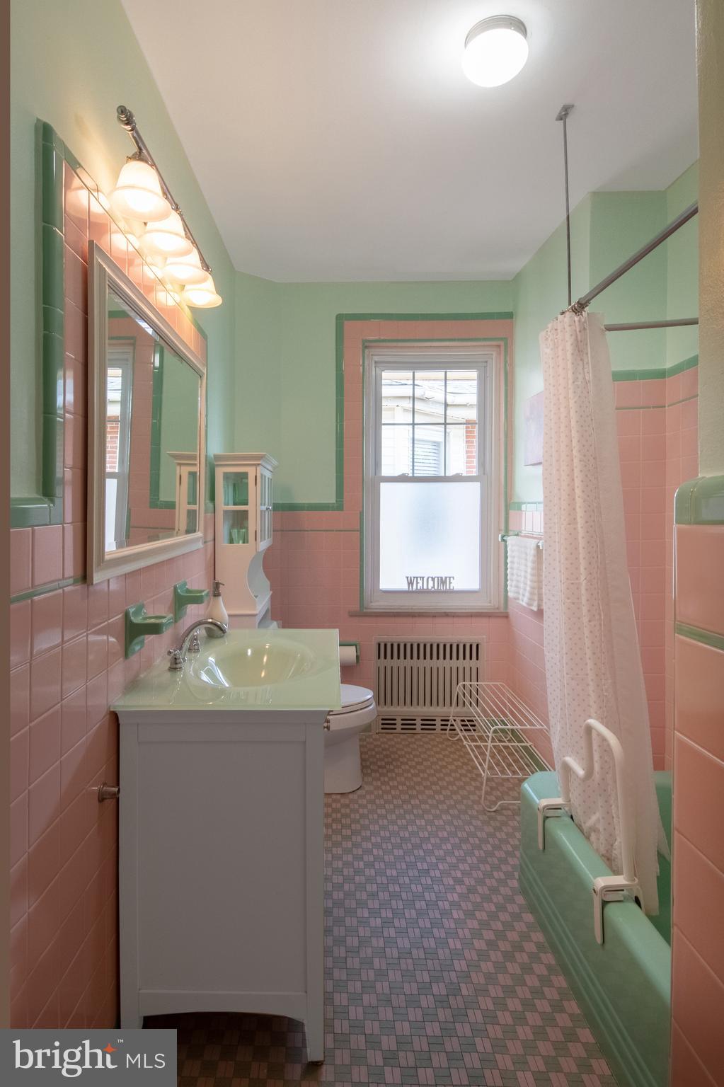 2526 South Cleveland Street Philadelphia, PA 19145 - Photo 25 of 29 a bathroom with a granite countertop sink a toilet a mirror and shower