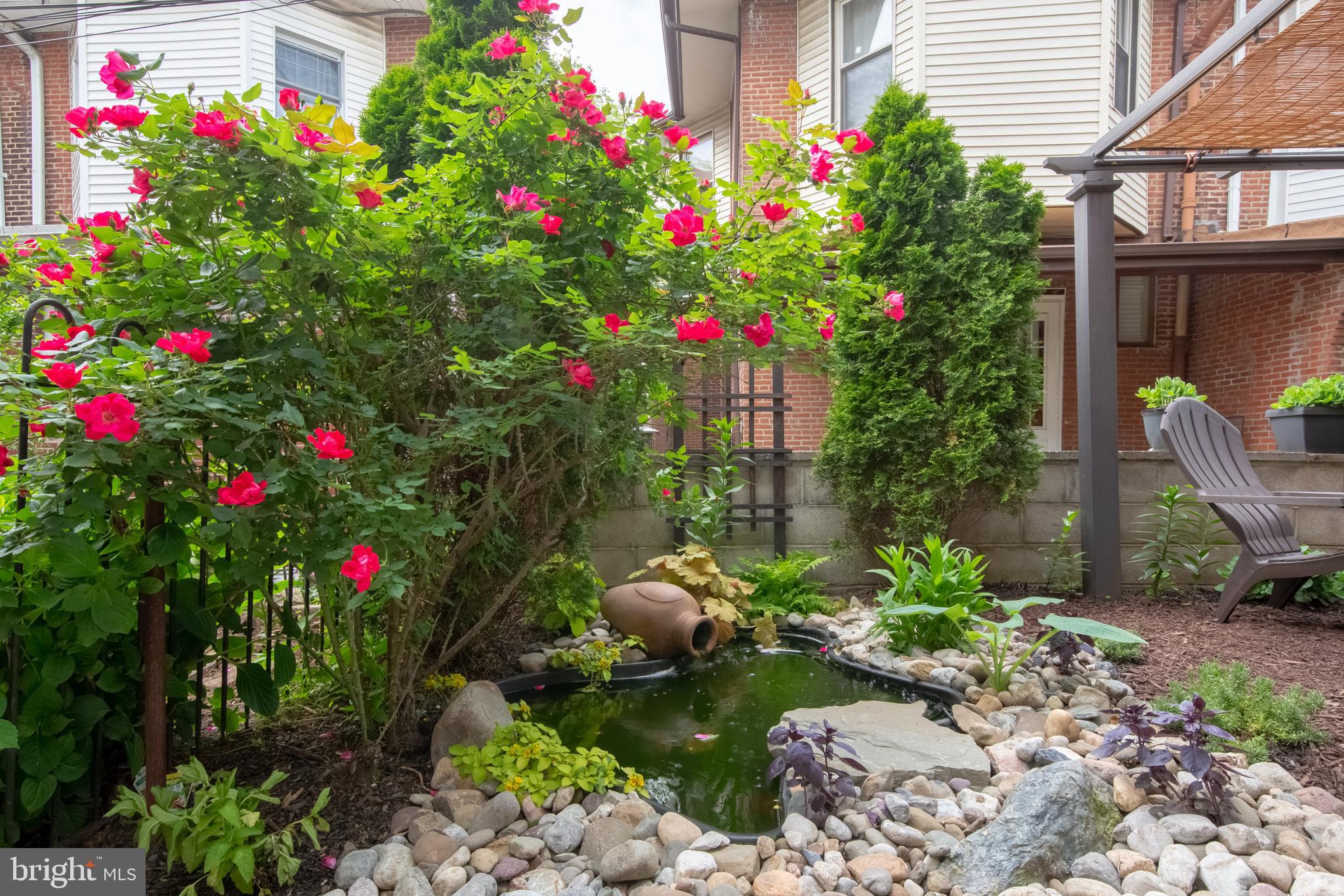 2526 South Cleveland Street Philadelphia, PA 19145 - Photo 29 of 29 a flower garden is sitting in front of flowers
