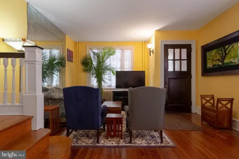 a view of a livingroom with furniture and a flat screen tv