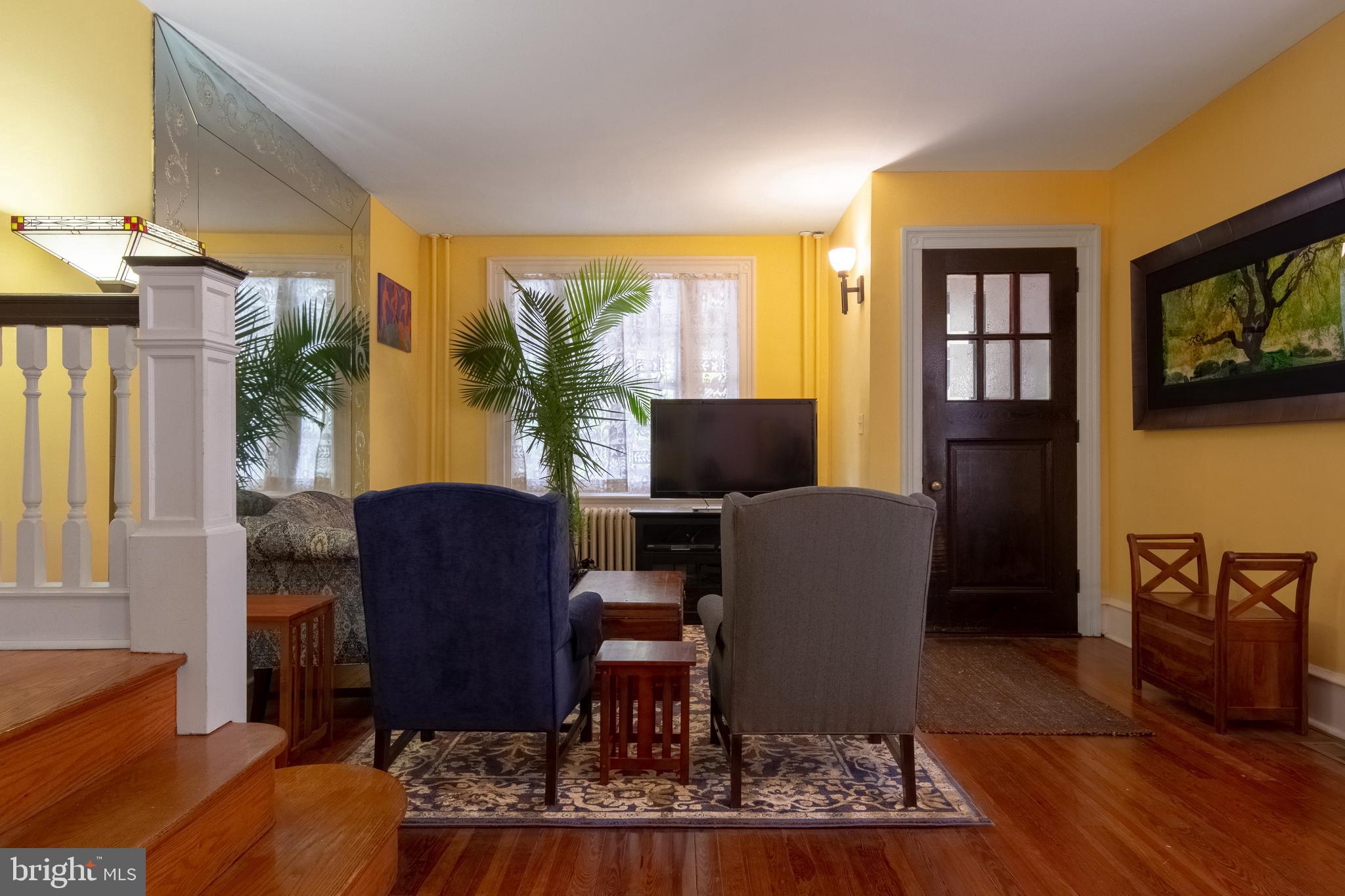 2526 South Cleveland Street Philadelphia, PA 19145 - Photo 9 of 29 a view of a livingroom with furniture and a flat screen tv