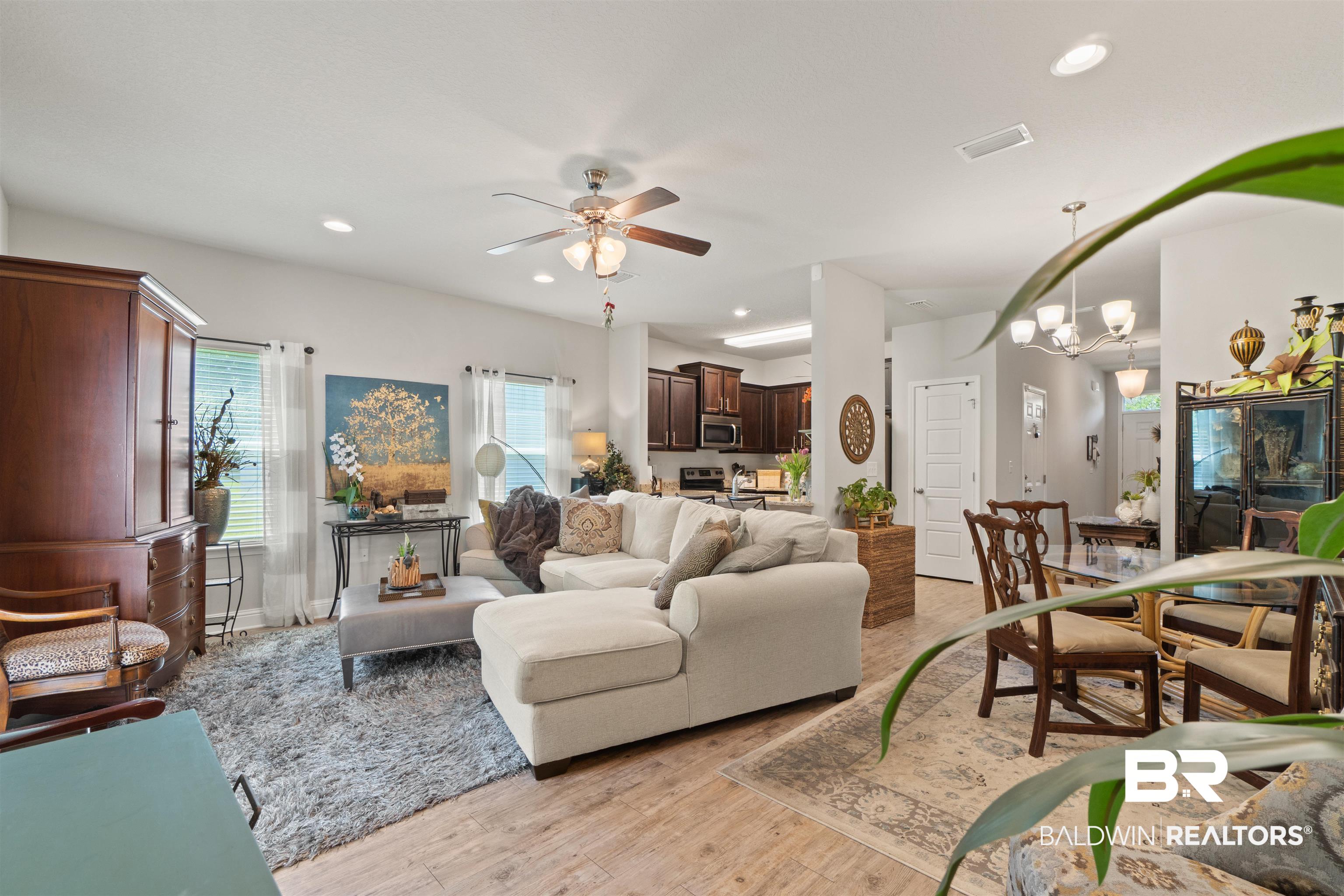 25806 Pollard Road, Unit 6 Daphne, AL 36526 - Photo 5 of 38 Bright living area featuring wood-finish flooring, recessed lighting, and a ceiling fan