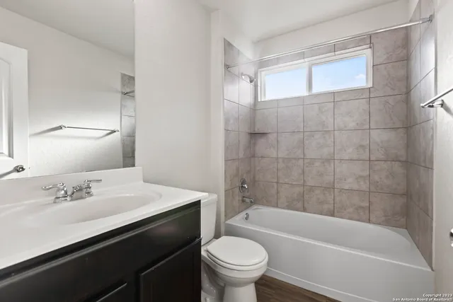 a bathroom with a sink a toilet and a bathtub