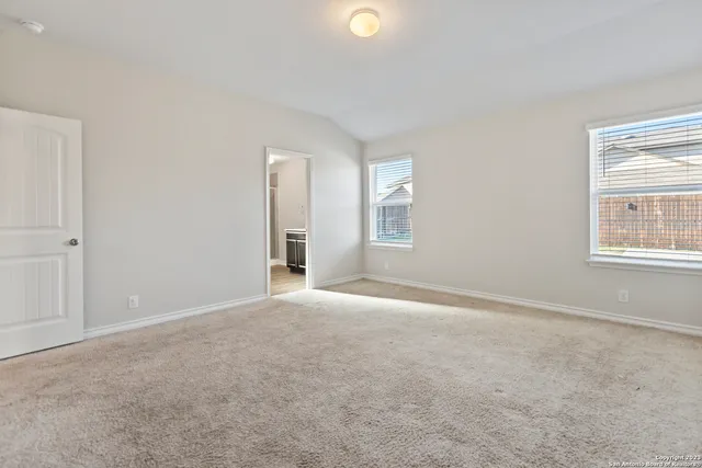 a view of an empty room and closet area