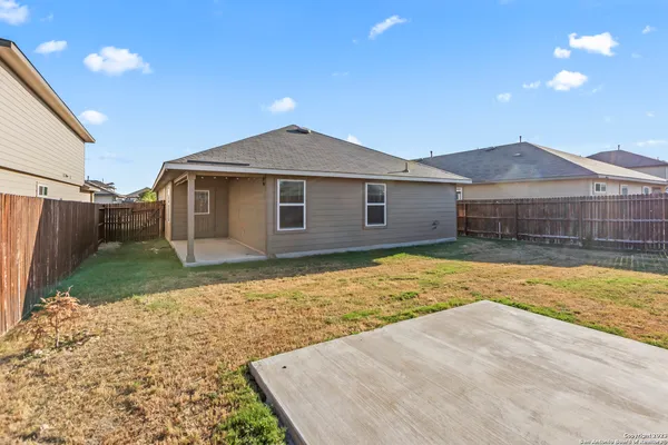 a view of a yard in front of a house with a yard