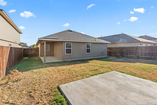 a view of a yard in front of a house with a yard
