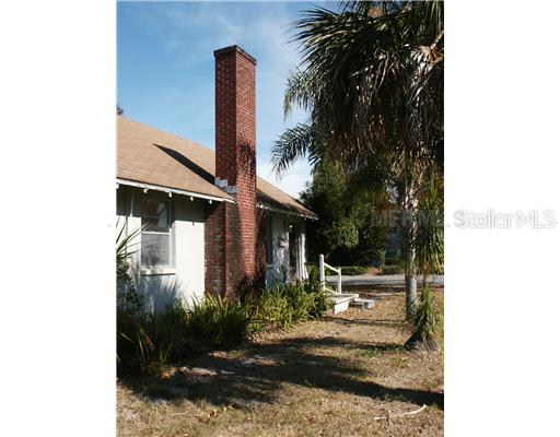 5839 Grand Boulevard New Port Richey, FL 34652 - Photo 1 of 1 a front view of a house with garden