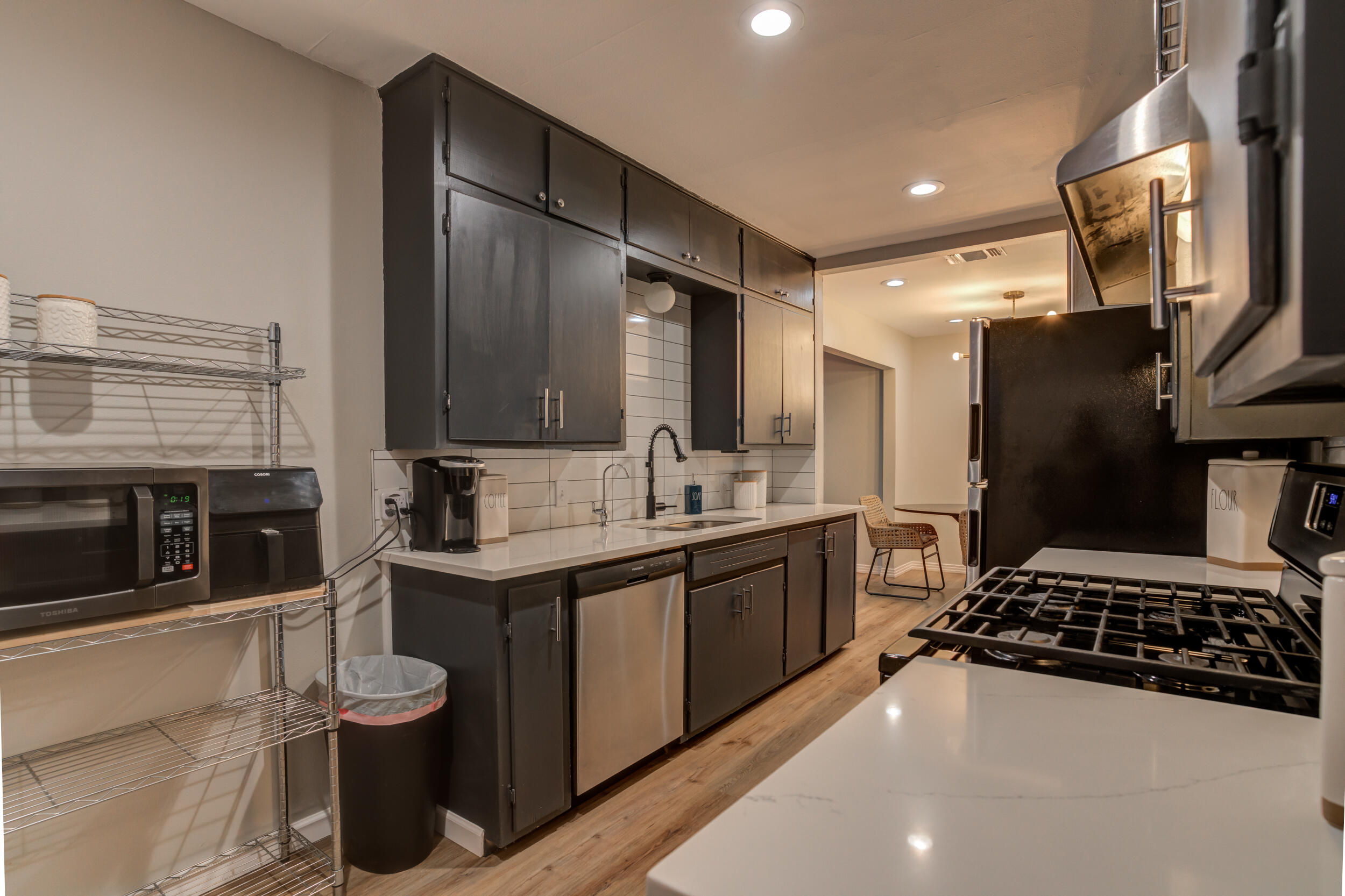 2802 39th Street Lubbock, TX 79413 - Photo 19 of 61 a kitchen with stainless steel appliances a sink stove and refrigerator
