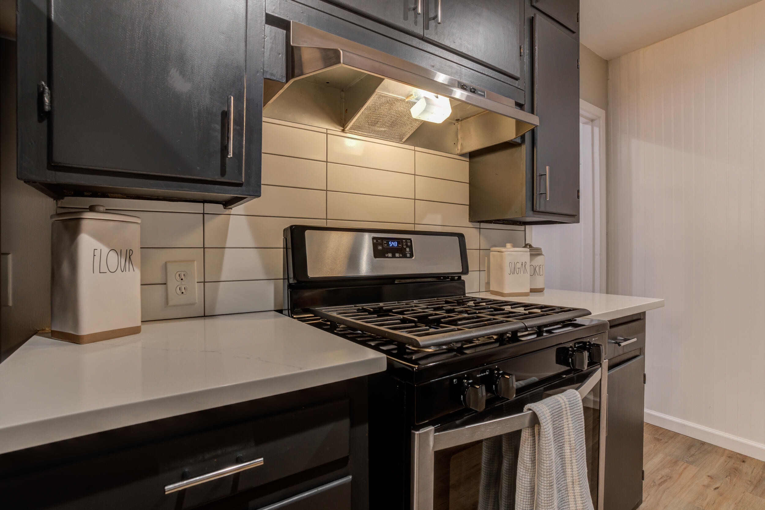 2802 39th Street Lubbock, TX 79413 - Photo 22 of 61 a kitchen with a stove and a microwave