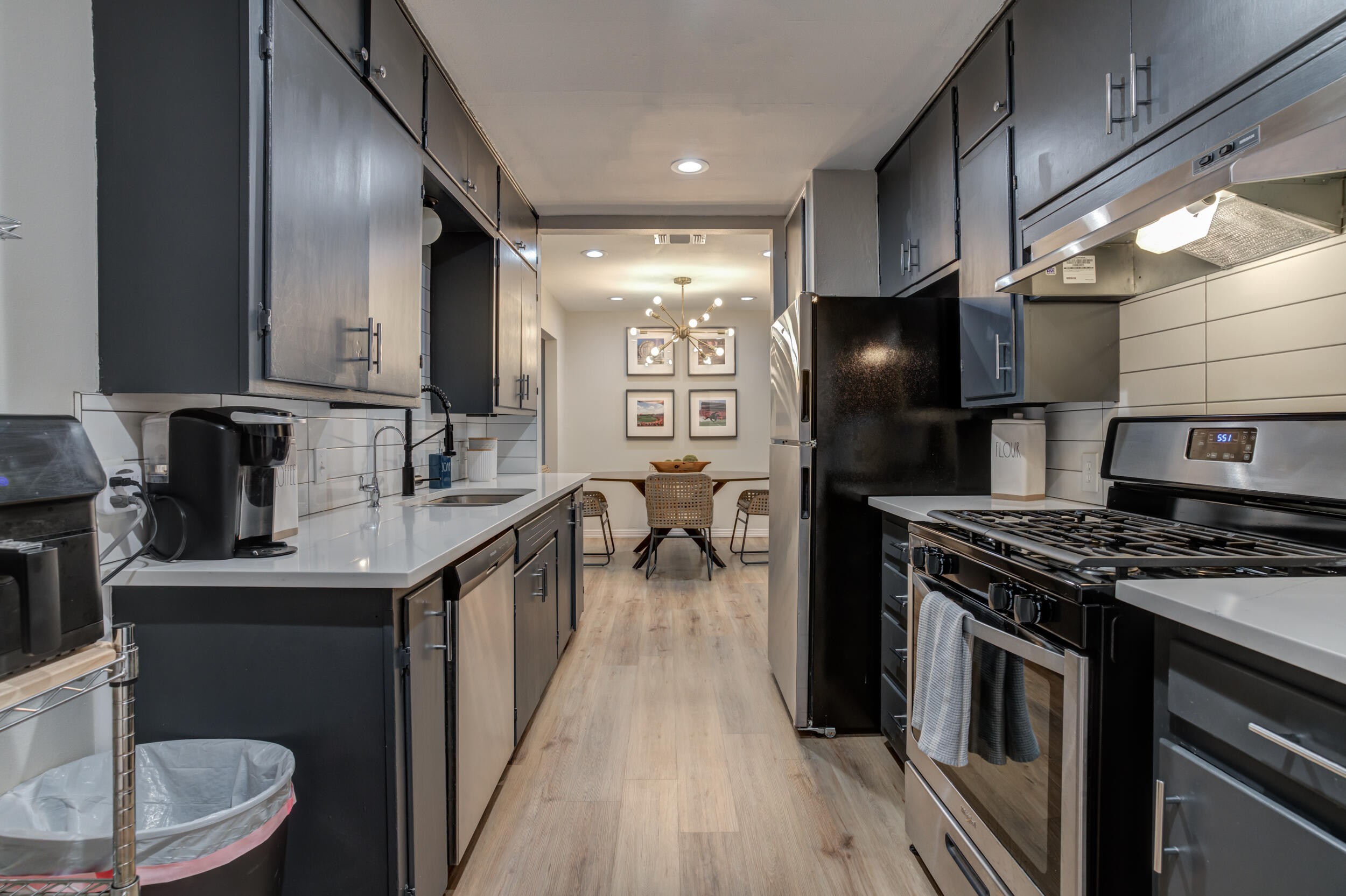 2802 39th Street Lubbock, TX 79413 - Photo 26 of 61 a kitchen with a sink stainless steel appliances a sink and cabinets