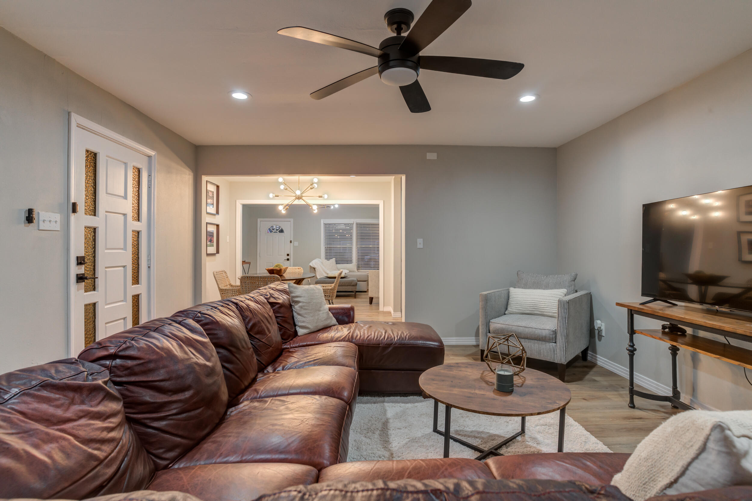 2802 39th Street Lubbock, TX 79413 - Photo 33 of 61 a living room with furniture and a flat screen tv