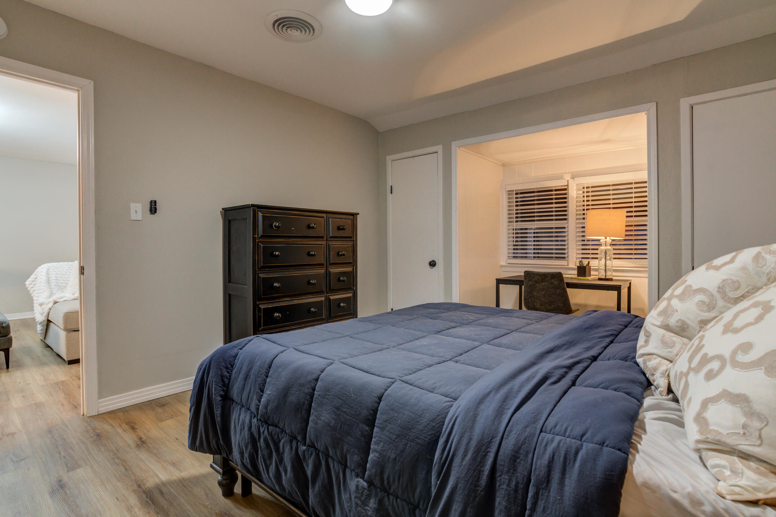2802 39th Street Lubbock, TX 79413 - Photo 38 of 61 a bedroom with a bed and a dresser