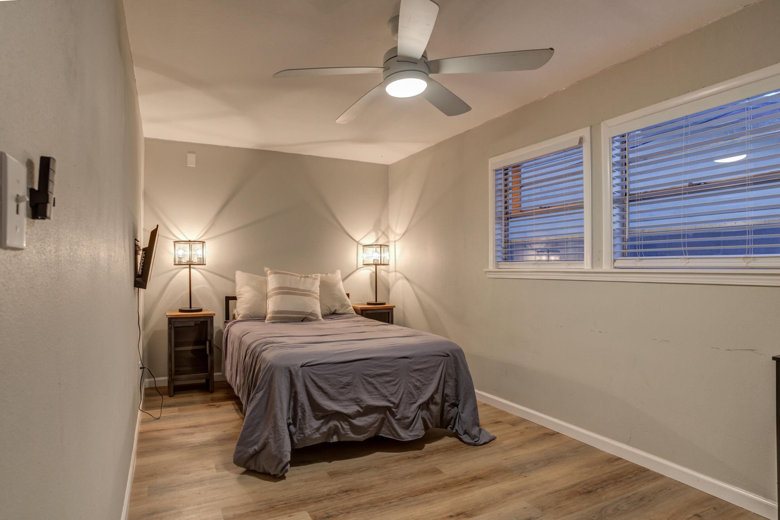 2802 39th Street Lubbock, TX 79413 - Photo 42 of 61 a bedroom with a bed and a ceiling fan