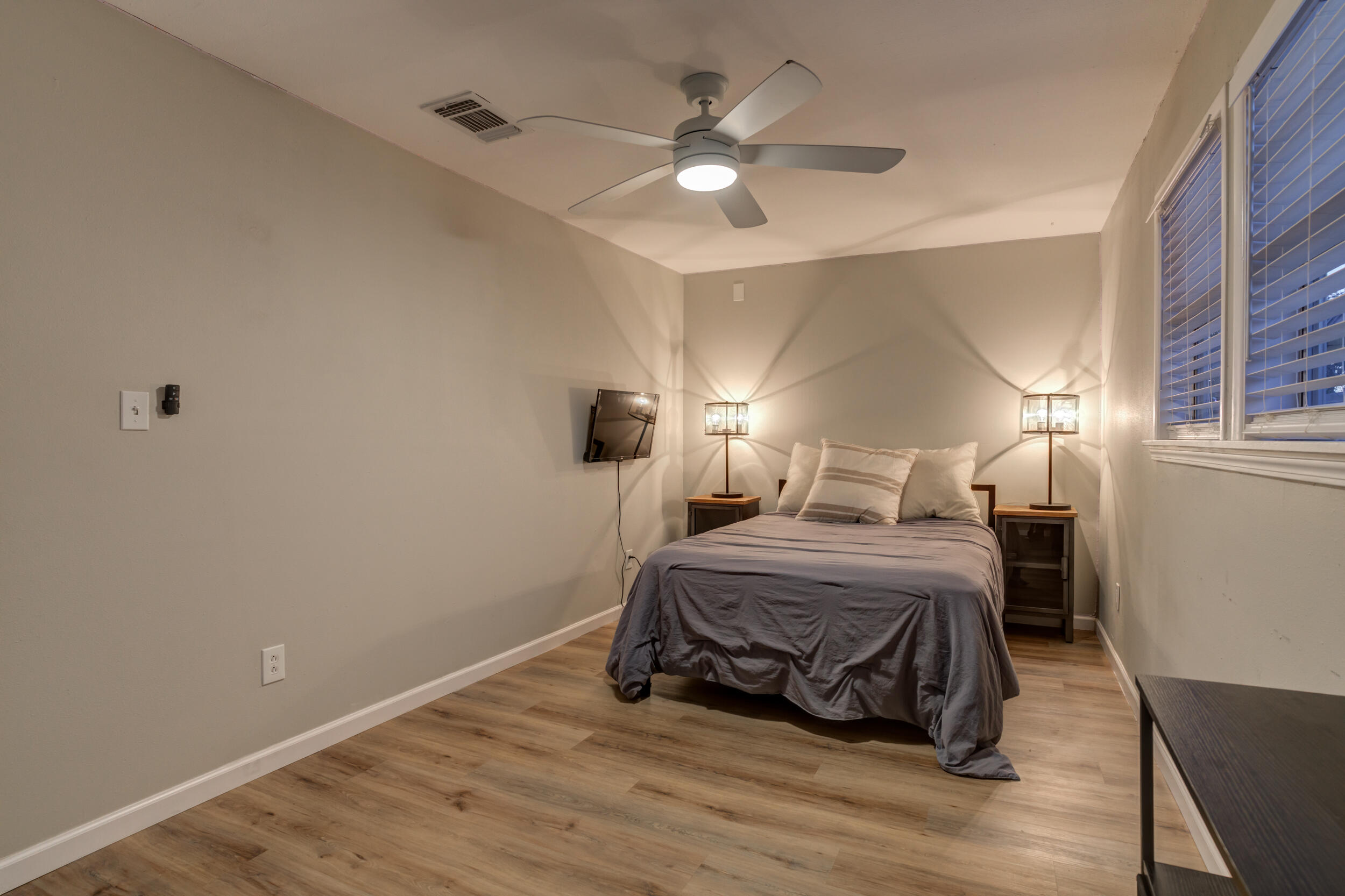 2802 39th Street Lubbock, TX 79413 - Photo 43 of 61 a bedroom with a bed and a ceiling fan