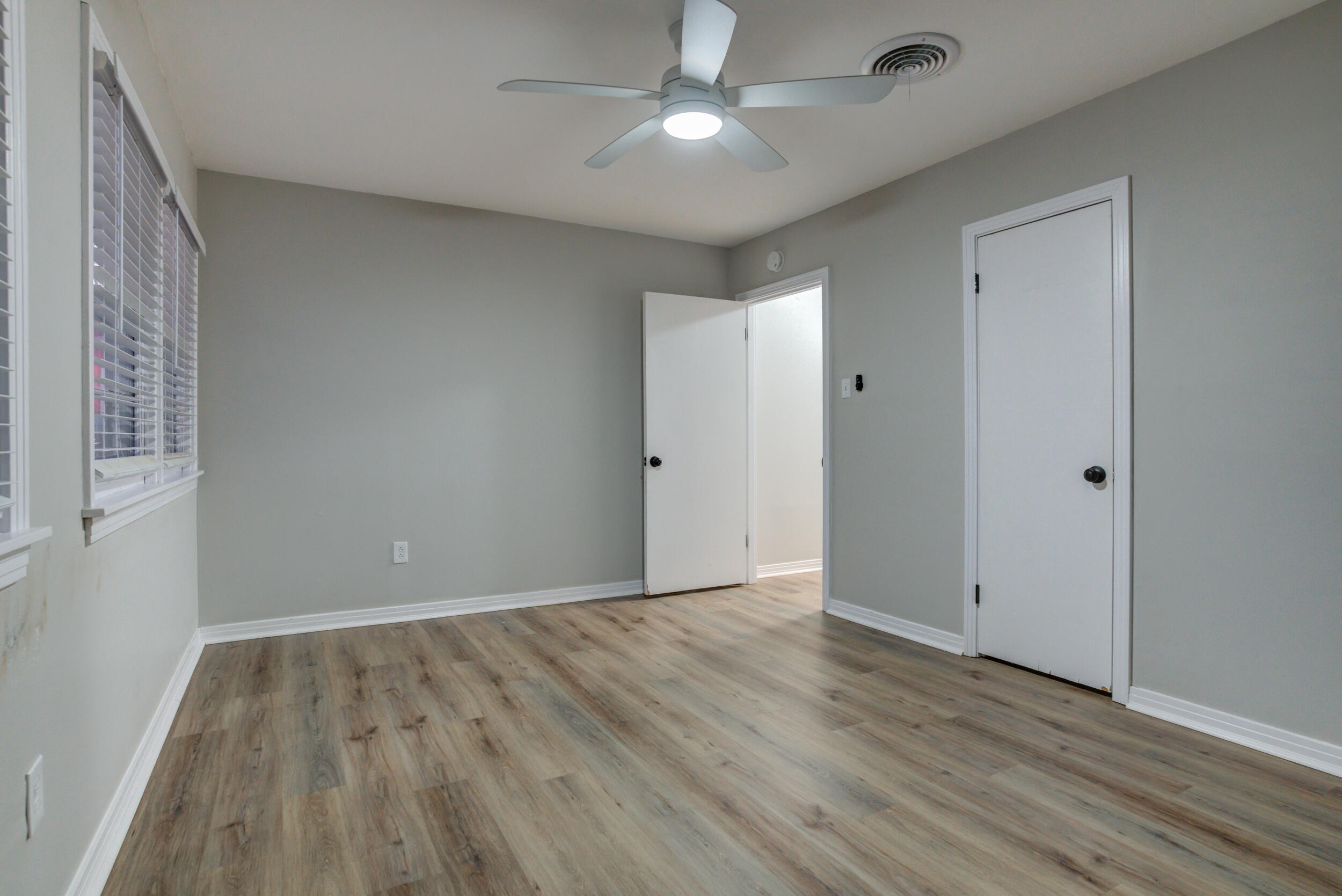 2802 39th Street Lubbock, TX 79413 - Photo 45 of 61 a view of an empty room with wooden floor