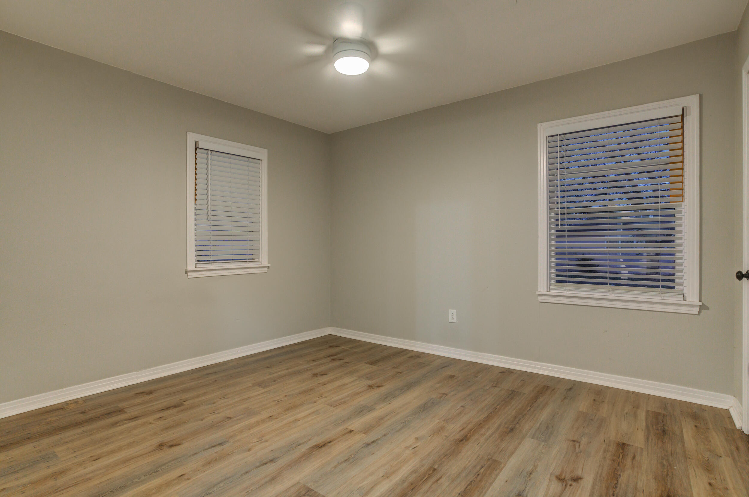2802 39th Street Lubbock, TX 79413 - Photo 46 of 61 a view of a room with wooden floor and windows