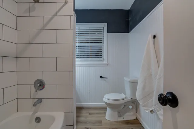 a view of a house with a yard and garage
