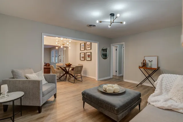 a living room with furniture and a table