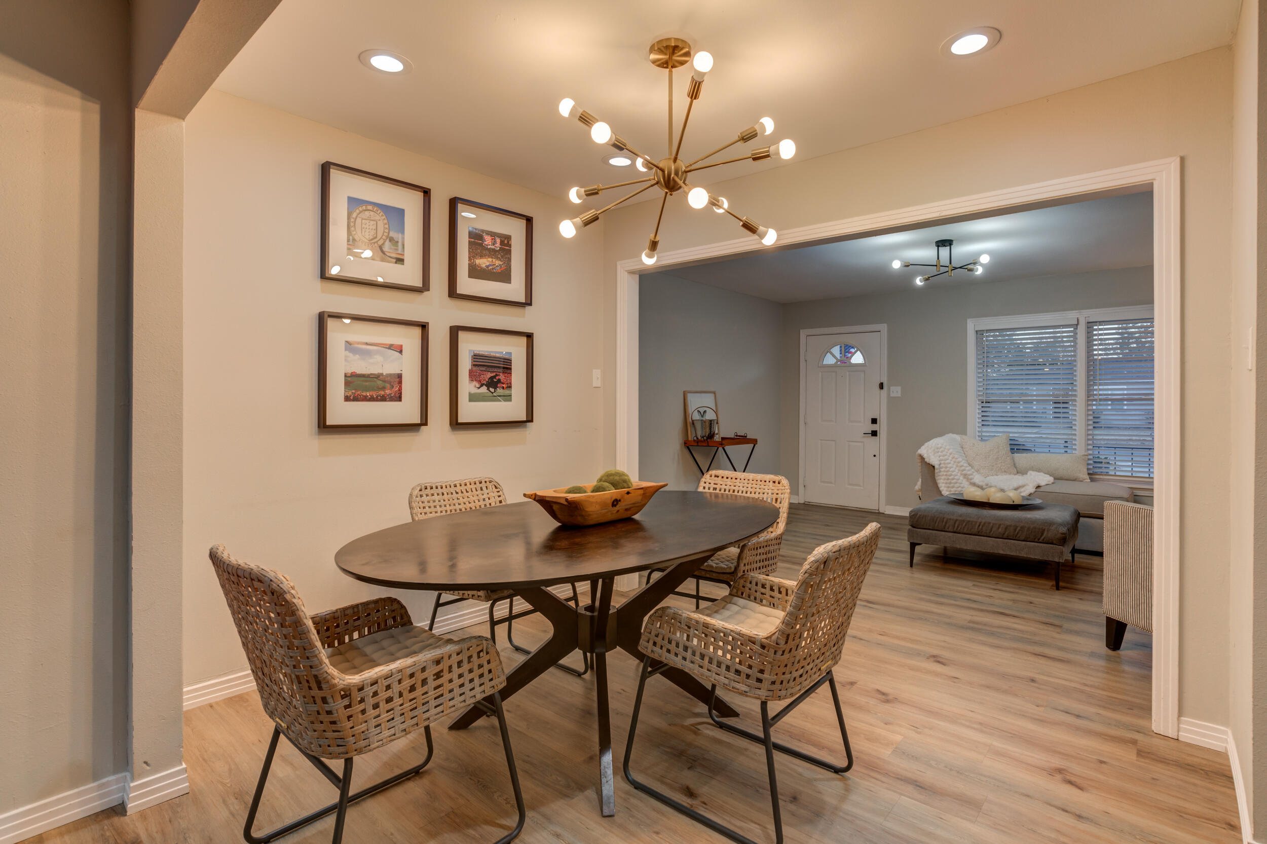 2802 39th Street Lubbock, TX 79413 - Photo 10 of 61 a view of a dining room with furniture and wooden floor