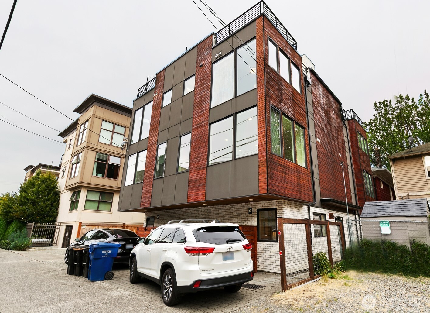 119 A 18th Avenue East Seattle, WA 98112 - Photo 1 of 24 a car parked in front of a building
