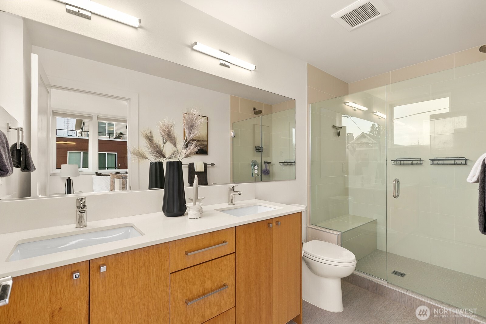 119 A 18th Avenue East Seattle, WA 98112 - Photo 19 of 24 a bathroom with a granite countertop sink a toilet and shower