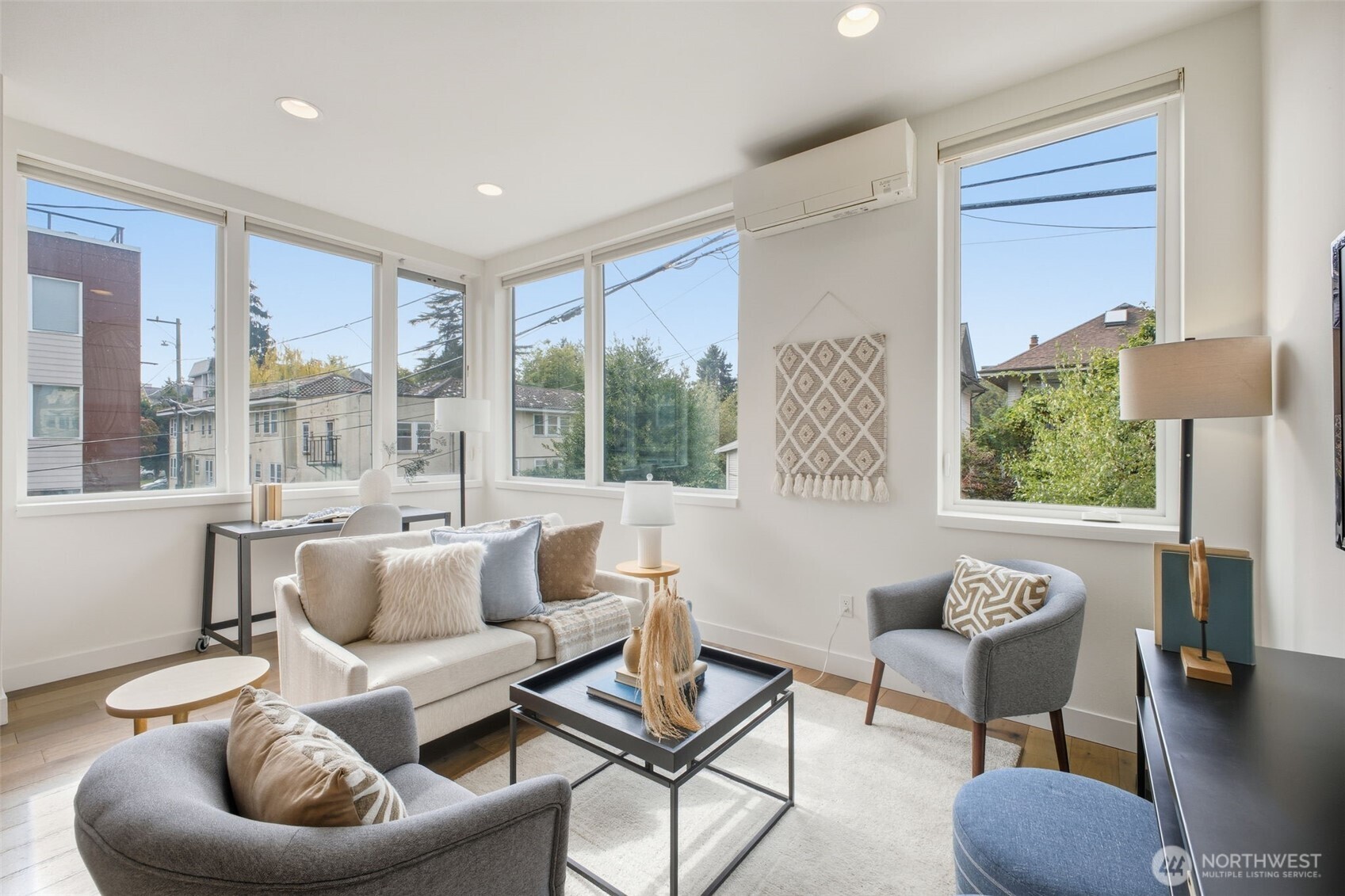 119 A 18th Avenue East Seattle, WA 98112 - Photo 7 of 24 a living room with furniture and a large window
