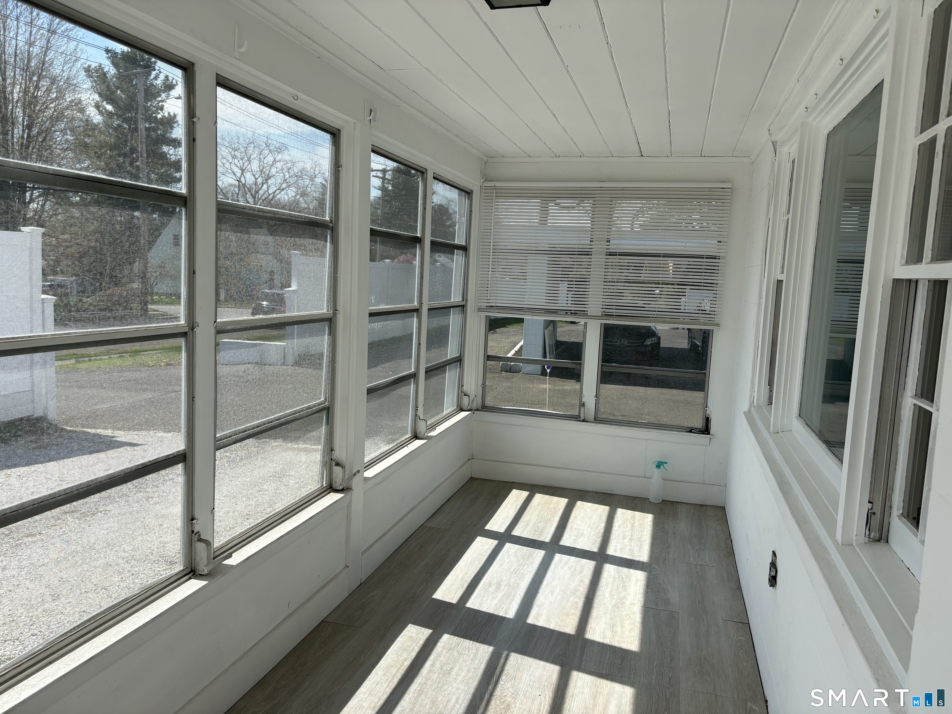 832 Milford Point Road Milford, CT 06460 - Photo 3 of 11 a view of an empty room with a window