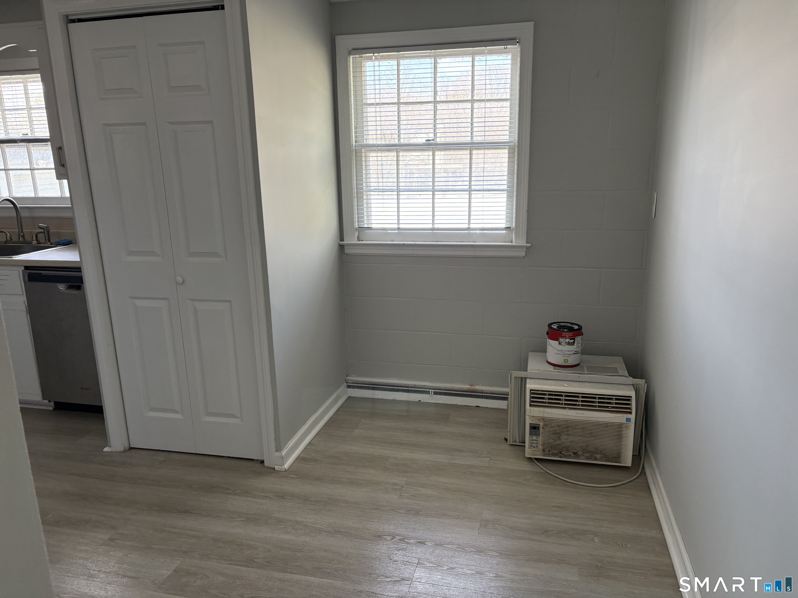 832 Milford Point Road Milford, CT 06460 - Photo 6 of 11 a view of a room with wooden floor and window