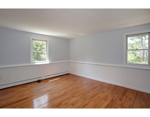 215 Simons Road Mashpee, MA 02649 - Photo 12 of 19 a view of an empty room with wooden floor and a window