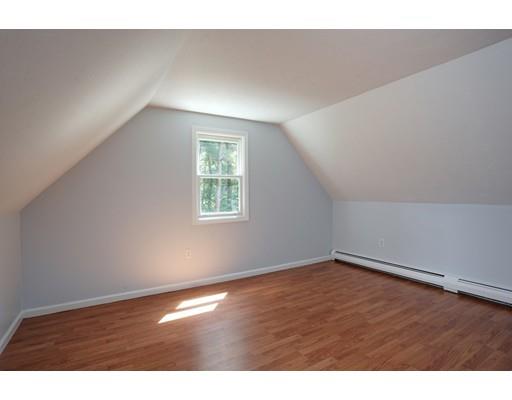 215 Simons Road Mashpee, MA 02649 - Photo 13 of 19 an empty room with wooden floor and windows