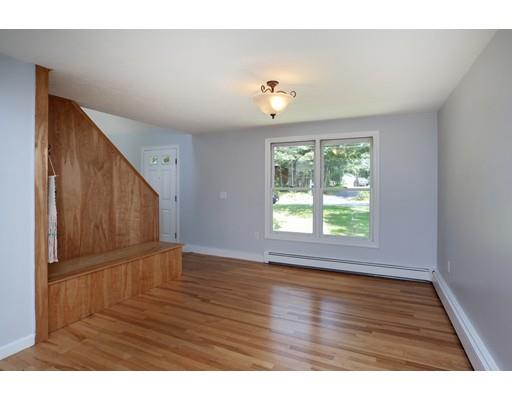 215 Simons Road Mashpee, MA 02649 - Photo 10 of 19 a view of an empty room with wooden floor and a window