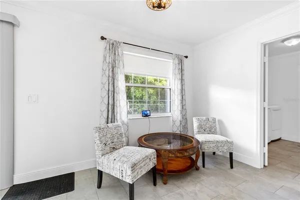 a living room with furniture and a window