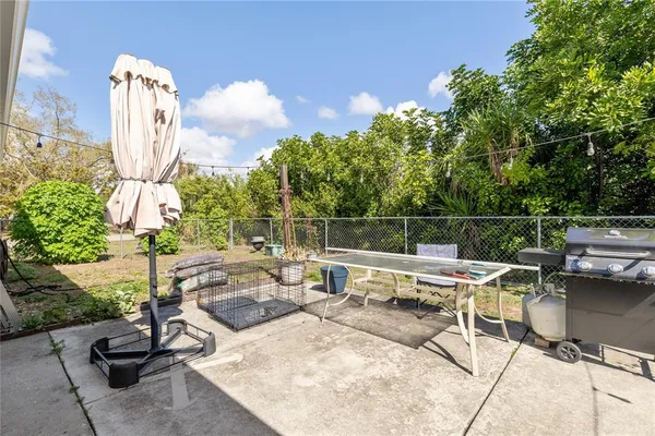 a view of a chairs and table in the patio