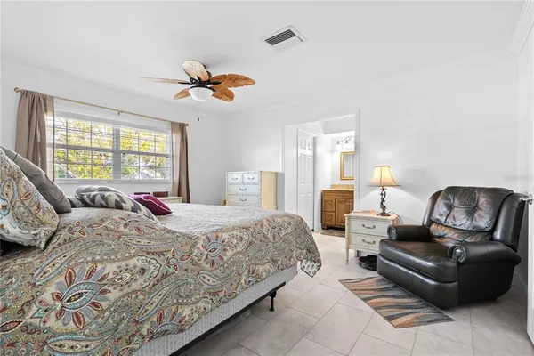 a bedroom with a bed and couch