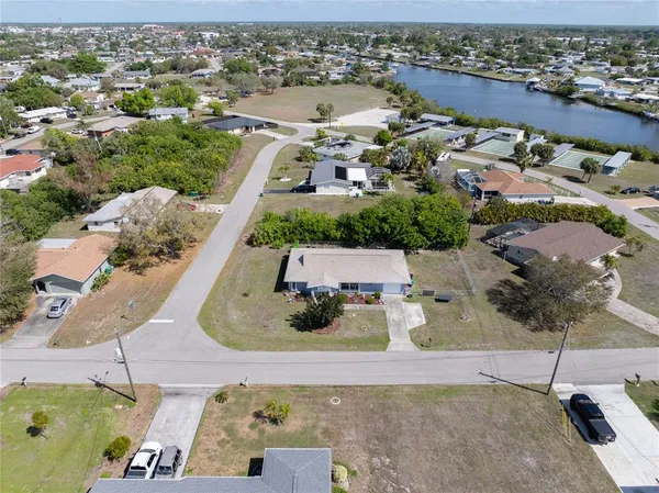 an aerial view of a house with a yard