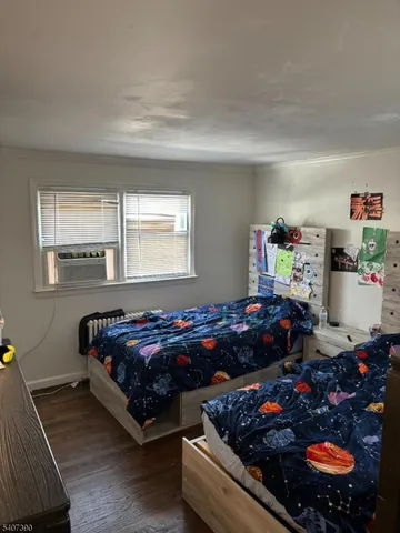 a bedroom with furniture and a window