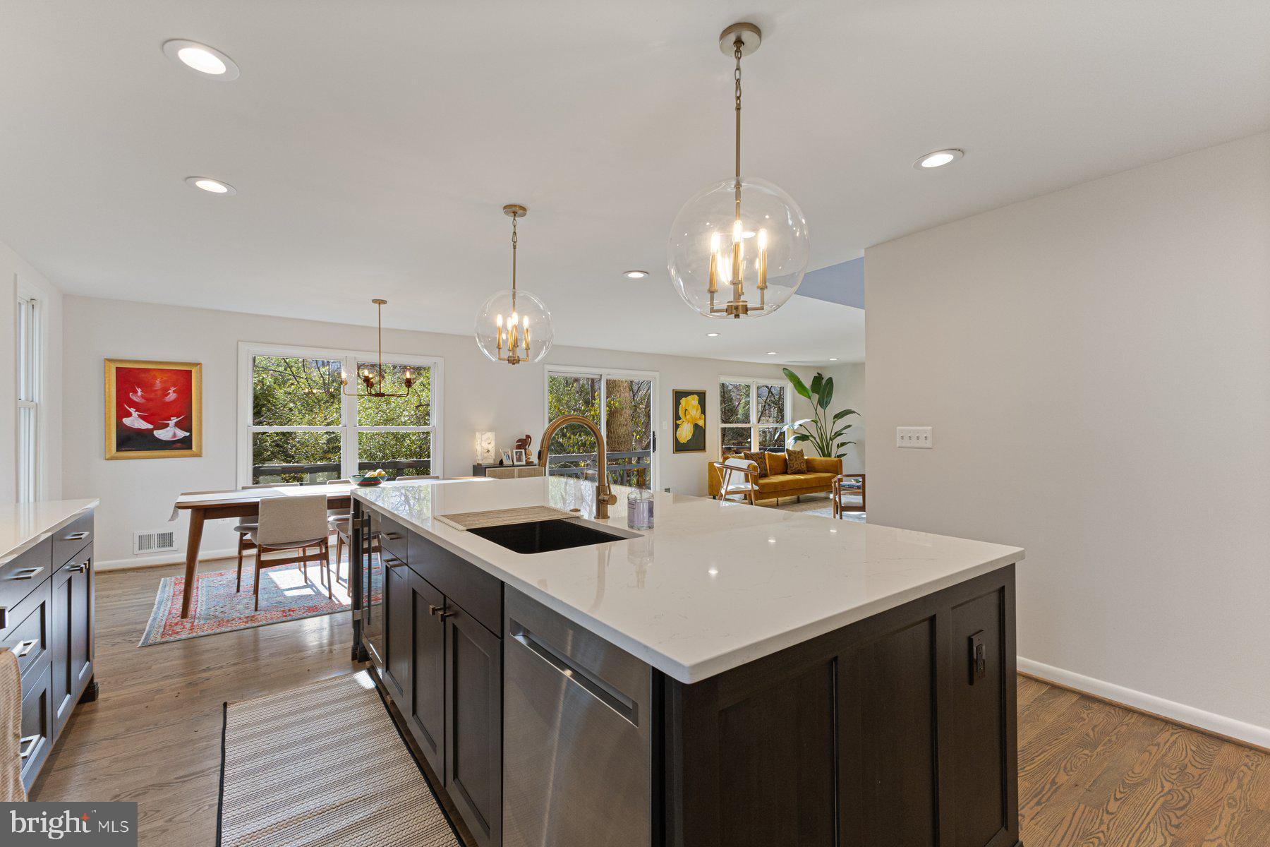 1875 Massachusetts Avenue McLean, VA 22101 - Photo 12 of 52 a kitchen that has a sink a stove and a table with chairs