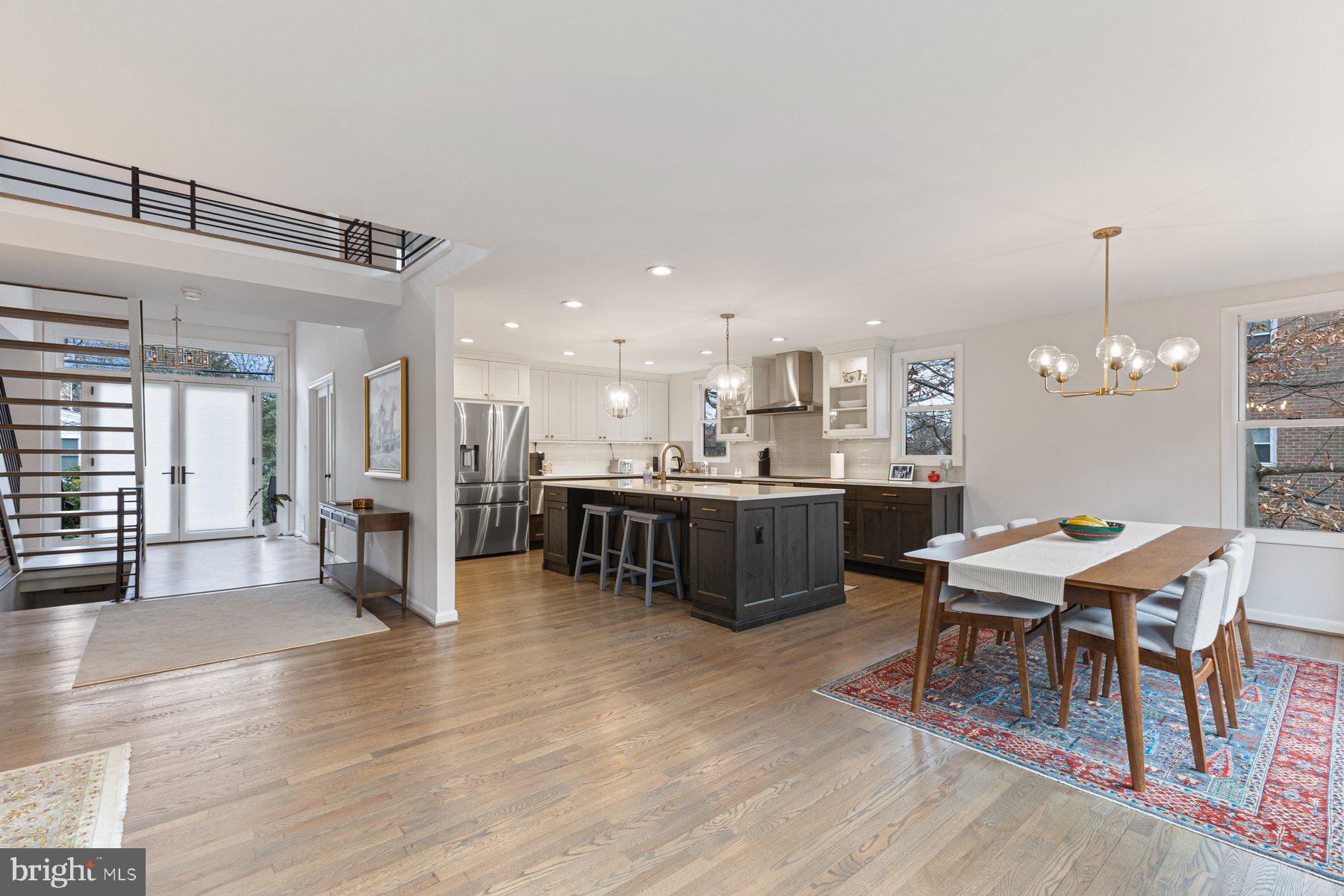 1875 Massachusetts Avenue McLean, VA 22101 - Photo 14 of 52 a view of a dining room and livingroom with furniture wooden floor a chandelier