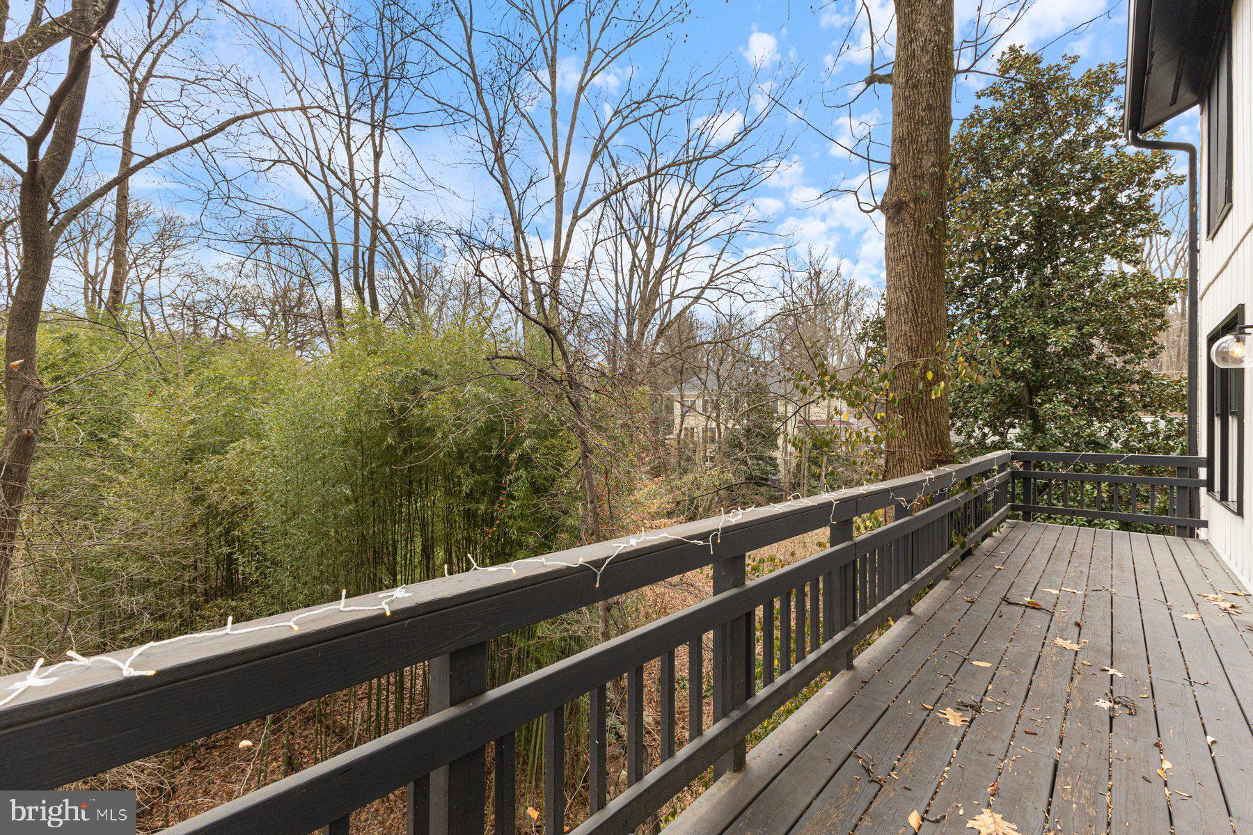 1875 Massachusetts Avenue McLean, VA 22101 - Photo 18 of 52 a view of balcony with wooden floor and fence
