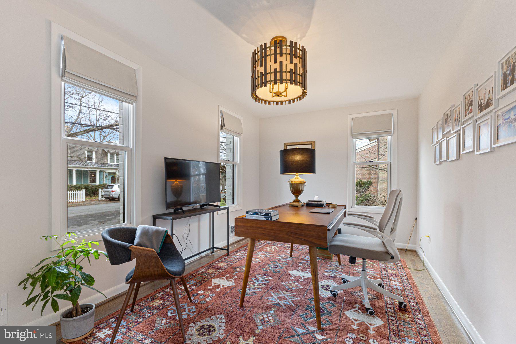 1875 Massachusetts Avenue McLean, VA 22101 - Photo 19 of 52 a living room with furniture a flat screen tv and a window