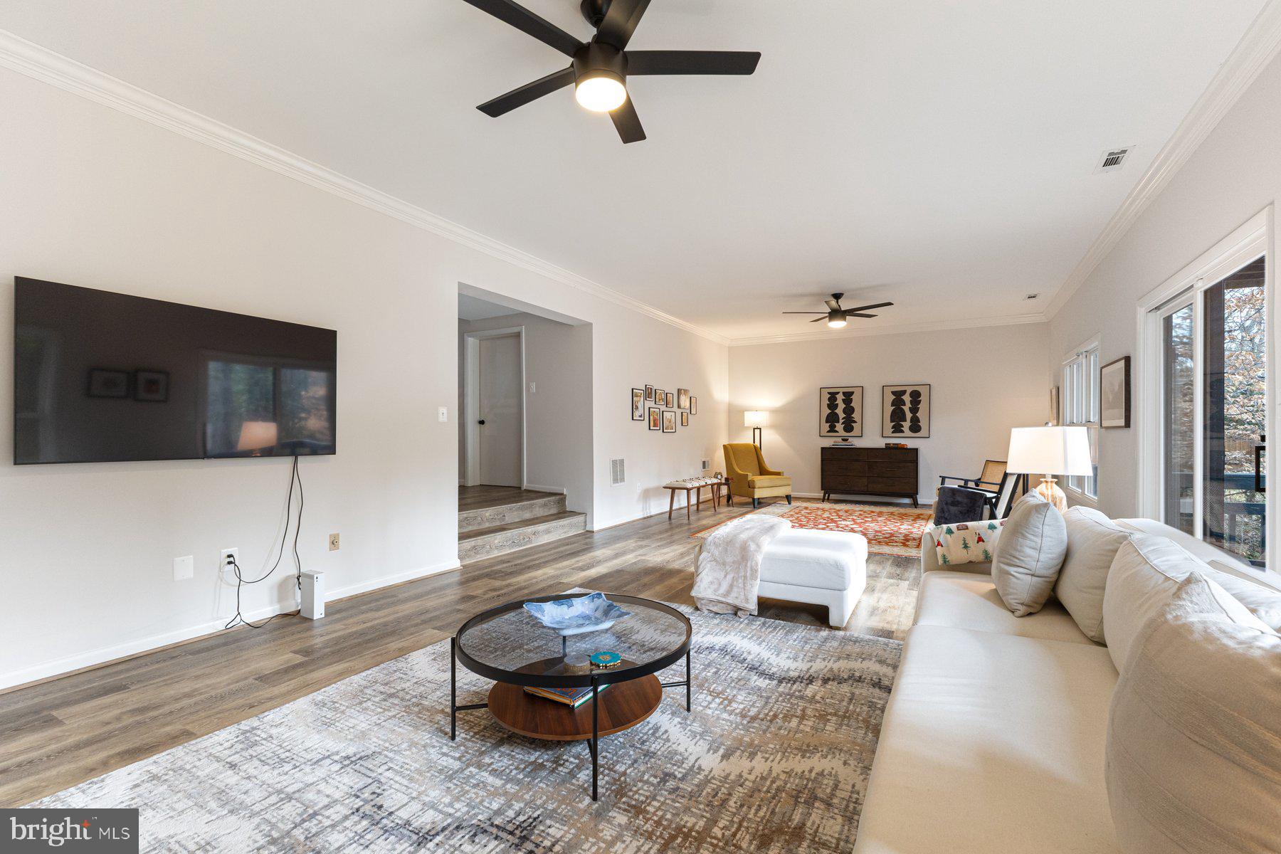 1875 Massachusetts Avenue McLean, VA 22101 - Photo 29 of 52 a living room with furniture and a flat screen tv