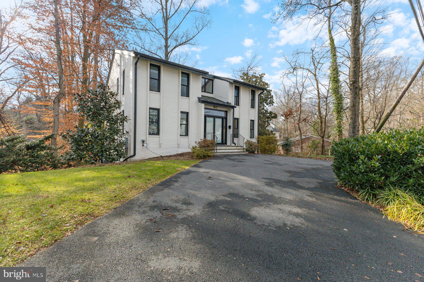 1875 Massachusetts Avenue McLean, VA 22101 - Photo 3 of 52 a view of a building with a yard