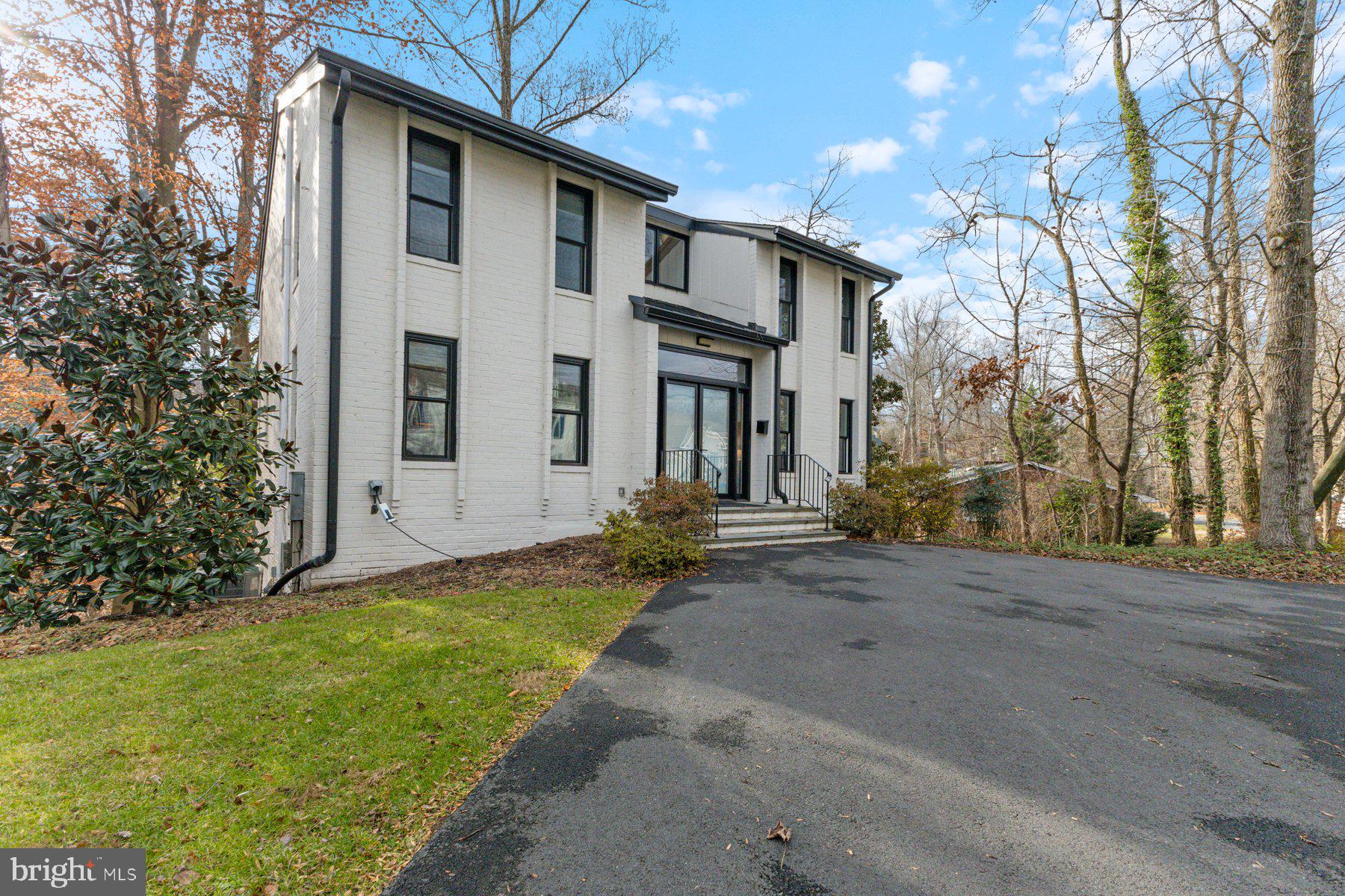 1875 Massachusetts Avenue McLean, VA 22101 - Photo 4 of 52 a view of a house with backyard and trees